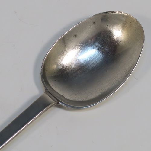 A very handsome Antique James II Sterling Silver Trefid-end table spoon, having a lace-backed rattail pattern bowl, which is slightly worn down on one side (consistent with right-hand usage), together with a trefid terminal having engraved contemporaneous sets of initials on both sides. In original condition with fine patina and colour this elegant James II silver spoon was hallmarked for London in 1688. The dimensions of this fine hand-made antique silver seventeenth century table spoon are length 20cms (8 inches), and it weighs approx. 55g (1.8 troy ounces).