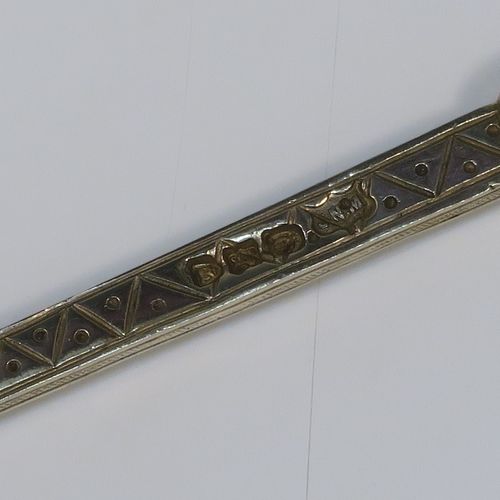 A large and beautiful Antique Victorian Sterling Silver and gold-gilt serving spoon, in the Coronation Anointing pattern with hand-engraved floral decoration to the bowl, and a cast ornate and twisted handle. This fantastic silver and gold-gilt Coronation serving spoon was made by Mappin and Webb of London in 1891. The dimensions of this fine hand-made antique silver Coronation Anointing spoon are length 26 cms (10.25 inches), and it weighs approx. 105g (3.4 troy ounce).