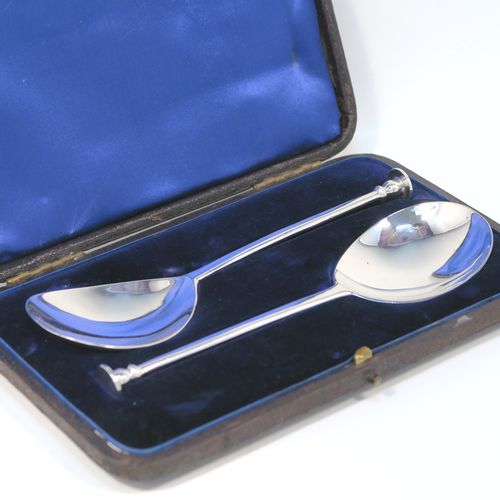 A very handsome pair of Antique Victorian Sterling Silver serving spoons in an old seal-top style, having cast handles and plain round bowls, all in their original dark blue satin and velvet-lined velvet-lined presentation box. These beautiful silver seal-top serving spoons were made by John Edward Wilmot of Birmingham in 1897. The dimensions of this fine hand-made pair of antique silver serving spoons are length 15 cms (6 inches), and they weigh a total of approx. 78g (2.5 troy ounces).   