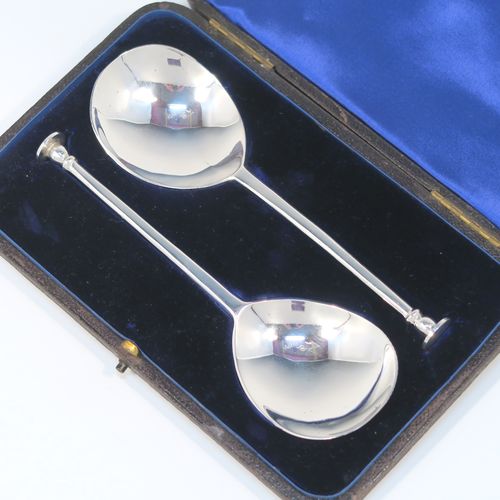 A very handsome pair of Antique Victorian Sterling Silver serving spoons in an old seal-top style, having cast handles and plain round bowls, all in their original dark blue satin and velvet-lined velvet-lined presentation box. These beautiful silver seal-top serving spoons were made by John Edward Wilmot of Birmingham in 1897. The dimensions of this fine hand-made pair of antique silver serving spoons are length 15 cms (6 inches), and they weigh a total of approx. 78g (2.5 troy ounces).