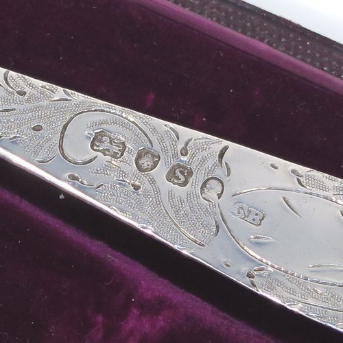 A very pretty pair of Antique Georgian Sterling Silver berry serving spoons, having hand-chased handles with geometric and floral decoration, and hand-chased bowls with fluted and fruit decoration, all in their original purple satin and velvet-lined presentation box. These beautiful silver serving spoons were made by George Burrows of London in 1793. The dimensions of this fine hand-made pair of antique silver berry spoons are length 22.5cms (8.75 inches), and they weigh a total of approx. 109g (3.5 troy ounces).   