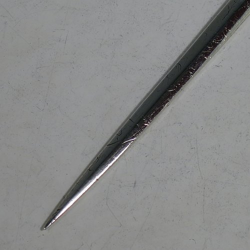 An Antique Georgian Sterling Silver meat or game bird skewer, having a very plain tapering body with ring handle. Made by Richard Crossley of London in 1794. The dimensions of this fine hand-made antique silver game bird or meat skewer are length 29 cms (11.5 inches), and it weighs approx. 98g (3 troy ounces). Please note that this item is in original condition with a crest and it still has the old scratch marks from using a carving knife.
