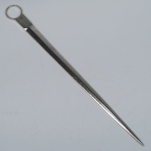 A very handsome Antique Georgian George III Sterling Silver meat or game bird skewer, having a very plain tapering body with a plain ring handle. This elegant antique silver skewer was made by Eley, Fern and Chawner of London in 1809. The dimensions of this fine hand-made antique silver game bird or meat skewer are length 28 cms (11 inches), and it weighs approx. 78g (2.5 troy ounces). Please note that this item is in original condition and it still has the old scratch marks from using a carving knife.  