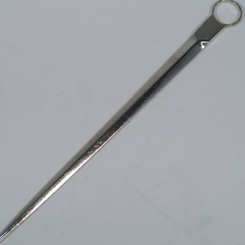 A very handsome Antique Georgian George III Sterling Silver meat or game bird skewer, having a very plain tapering body with a plain ring handle. This elegant antique silver skewer was made by Eley, Fern and Chawner of London in 1809. The dimensions of this fine hand-made antique silver game bird or meat skewer are length 28 cms (11 inches), and it weighs approx. 78g (2.5 troy ounces). Please note that this item is in original condition and it still has the old scratch marks from using a carving knife.