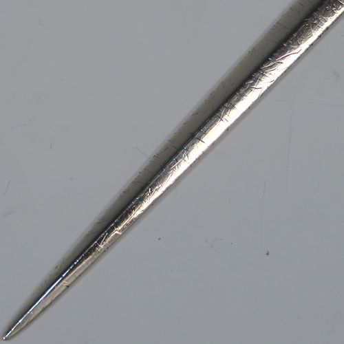 A very handsome Antique Georgian George III Sterling Silver meat or game bird skewer, having a very plain tapering body with a plain ring handle. This elegant antique silver skewer was made by Eley, Fern and Chawner of London in 1809. The dimensions of this fine hand-made antique silver game bird or meat skewer are length 28 cms (11 inches), and it weighs approx. 78g (2.5 troy ounces). Please note that this item is in original condition and it still has the old scratch marks from using a carving knife.