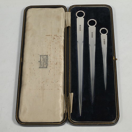 A very handsome set of three Antique Sterling Silver meat and game bird skewers, having very plain tapering bodies with ring handles, in three sizes and in their original cream satin and black velvet-lined presentation box. This elegant set of silver skewers were made by Martin Hall and Co. Ltd., of Sheffield in 1923. The dimensions of this fine hand-made set of Antique silver game bird or meat skewers are length of longest skewer 25.5 cms (10 inches), and they weigh a total of approx. 127g (4 troy ounces)