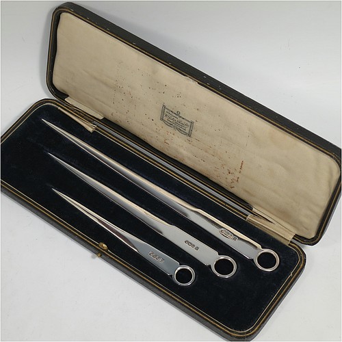 A very handsome set of three Antique Sterling Silver meat and game bird skewers, having very plain tapering bodies with ring handles, in three sizes and in their original cream satin and black velvet-lined presentation box. This elegant set of silver skewers were made by Martin Hall and Co. Ltd., of Sheffield in 1923. The dimensions of this fine hand-made set of Antique silver game bird or meat skewers are length of longest skewer 25.5 cms (10 inches), and they weigh a total of approx. 127g (4 troy ounces)