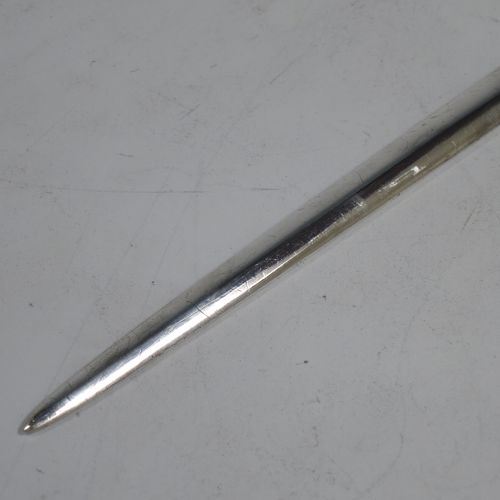 A large and very handsome Antique Georgian George II Sterling Silver meat or game bird skewer, having a very plain tapering body with a plain ring handle. Made by Louis Dupont of London in 1740. The dimensions of this fine hand-made antique silver game bird or meat skewer are length 32.5 cms (12.75 inches), and it weighs approx. 103g (3.3 troy ounces).