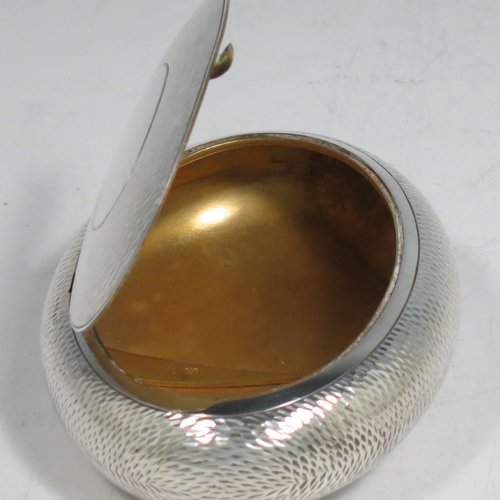 An Antique Edwardian Sterling Silver tobacco box, having an oval body, with engine-turned decoration, a vacant cartouche, a squeeze-action sprung hinged lid, and a gold-gilt interior. Made by Horton & Allday of Birmingham in 1903. The dimensions of this fine hand-made silver tobacco box are length 8 cms (3.25 inches), width 6 cms (2.3 inches), and it weighs approx. 62g (2 troy ounces).
