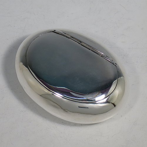 An Antique Victorian Sterling Silver tobacco box, having a plain oval body, and squeeze-action sprung hinged lid. Made by Elkington & Co., of Birmingham in 1901. The dimensions of this fine hand-made antique silver tobacco box are length 9 cms (3.5 inches), width 6.5 cms (2.5 inches), depth 3 cms (1.25 inches), and it weighs approx. 102g (3.3 troy ounces).