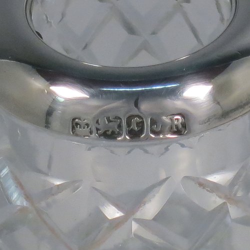 An Antique Victorian Sterling Silver and crystal match holder and striker, having a a very unusual round baluster body, with a silver rim around the match holder, a hand-cut hobnail pattern upper body and a lower ridged body for striking the matches. Made by James Round of Sheffield in 1895. The dimensions of this fine hand-made antique silver and crystal match striker are diameter 8.5 cms (3.3 inches), and height 9.5 cms (3.75 inches).