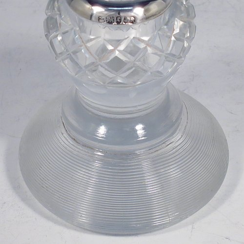 An Antique Victorian Sterling Silver and crystal match holder and striker, having a a very unusual round baluster body, with a silver rim around the match holder, a hand-cut hobnail pattern upper body and a lower ridged body for striking the matches. Made by James Round of Sheffield in 1895. The dimensions of this fine hand-made antique silver and crystal match striker are diameter 8.5 cms (3.3 inches), and height 9.5 cms (3.75 inches).