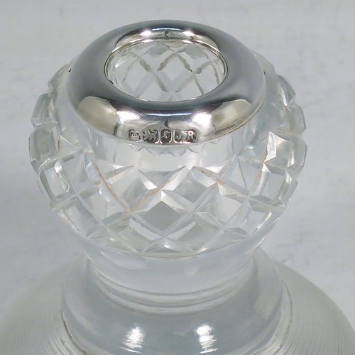 An Antique Victorian Sterling Silver and crystal match holder and striker, having a a very unusual round baluster body, with a silver rim around the match holder, a hand-cut hobnail pattern upper body and a lower ridged body for striking the matches. Made by James Round of Sheffield in 1895. The dimensions of this fine hand-made antique silver and crystal match striker are diameter 8.5 cms (3.3 inches), and height 9.5 cms (3.75 inches).