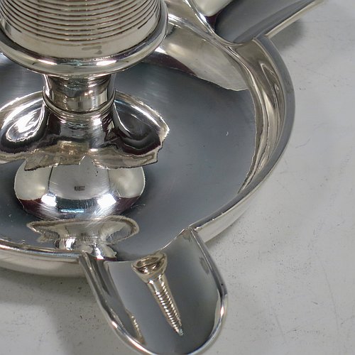 An Antique Edwardian Sterling Silver combination match holder, striker, and ash-tray, having a plain round body, with three cigarette holders, and a central match holder with sloping striker sides, and all sitting on a flat base. Made by Charles Cooke of Chester in 1902. The dimensions of this fine hand-made antique silver match striker and ash-tray are diameter 7.5 cms (3 inches), height 6 cms (2.3 inches), and it weighs approx. 60g (2 troy ounces).