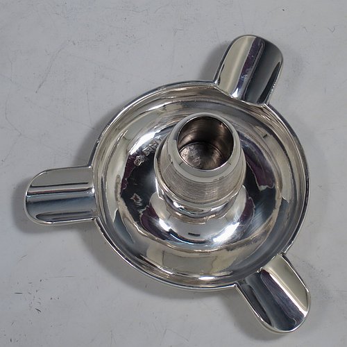 An Antique Edwardian Sterling Silver combination match holder, striker, and ash-tray, having a plain round body, with three cigarette holders, and a central match holder with sloping striker sides, and all sitting on a flat base. Made by Charles Cooke of Chester in 1902. The dimensions of this fine hand-made antique silver match striker and ash-tray are diameter 7.5 cms (3 inches), height 6 cms (2.3 inches), and it weighs approx. 60g (2 troy ounces).