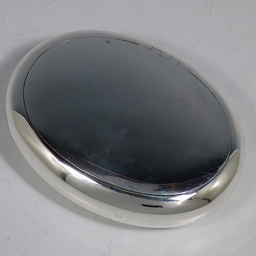 A large Antique Victorian Sterling Silver tobacco box, having a plain oval body with a gold-gilt interior, and squeeze-action sprung hinged lid with flat invisible hinge. Made by Horton & Allday of Birmingham in 1901. The dimensions of this fine hand-made antique silver tobacco box are length 11 cms (4.25 inches), width 8 cms (3.25 inches), depth 2.5 cms (1 inch), and it weighs approx. 119g (3.8 troy ounces).