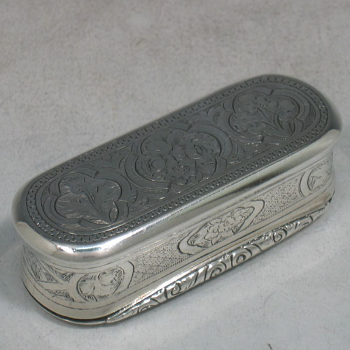 Antique Victorian sterling silver and gold-gilt snuff box made by George Unite of London in 1872. Originally presented to Joseph Wyatt, who we believe was the head groundsman of Wellbeck house. Hand engraved with floral work, and with three panels on base that have a thistle (for Scotland), a rose (for England), and a shamrock (for Ireland). Length 9 cms.