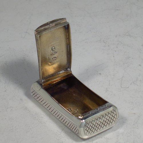 An Antique Georgian Sterling silver snuff box, having a rectangular body, with a slightly curved profile, with hand-engraved geometrical & floral decoration, a flat invisibly hinged lid with thumb-piece, and a gold-gilt interior. Made by Joseph Willmore of Birmingham in 1811. The dimensions of this fine hand-made antique silver snuff box are length 4.5 cms (1.75 inches), width 2.3 cms (0.8 inches), and it weighs approx. 17g (0.5 troy ounces).