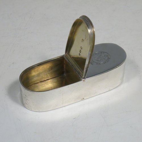 An Antique Georgian Sterling silver rare double compartment snuff box, having a plain rectangular body with rounded ends, straight sides, and a flat base, a central hinge with two fitted lids, and a gold-gilt interior. Made by Thomas Phipps & Edward Robinson of London 1793. The dimensions of this fine hand-made antique silver snuff box are length 9 cms (3.5 inches), width 3 cms (1.25 inches), depth 2 cms (0.75 inches), and it weighs approx. 71g (2.3 troy ounces). Please note that both lids are crested and monogrammed.