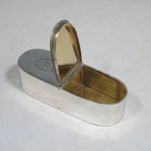 An Antique Georgian Sterling silver rare double compartment snuff box, having a plain rectangular body with rounded ends, straight sides, and a flat base, a central hinge with two fitted lids, and a gold-gilt interior. Made by Thomas Phipps & Edward Robinson of London 1793. The dimensions of this fine hand-made antique silver snuff box are length 9 cms (3.5 inches), width 3 cms (1.25 inches), depth 2 cms (0.75 inches), and it weighs approx. 71g (2.3 troy ounces). Please note that both lids are crested and monogrammed.