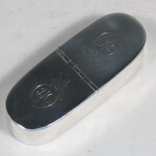 An Antique Georgian Sterling silver rare double compartment snuff box, having a plain rectangular body with rounded ends, straight sides, and a flat base, a central hinge with two fitted lids, and a gold-gilt interior. Made by Thomas Phipps & Edward Robinson of London 1793. The dimensions of this fine hand-made antique silver snuff box are length 9 cms (3.5 inches), width 3 cms (1.25 inches), depth 2 cms (0.75 inches), and it weighs approx. 71g (2.3 troy ounces). Please note that both lids are crested and monogrammed.