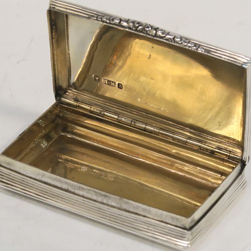 A beautiful Antique Victorian Sterling Silver snuff box, having a rectangular body with hand-engraved floral and scroll work, an applied cast foliate thumb-piece, and a gold-gilt interior. This elegant antique silver snuff box was made by Nathaniel Mills of Birmingham in 1850. The dimensions of this fine hand-made antique silver snuff box are length 7.5 cms (3 inches), width 4.5 cms (1.75 inches), depth 2 cms (0.6 inches), and it weighs approx. 69g (2.2 troy ounces).
