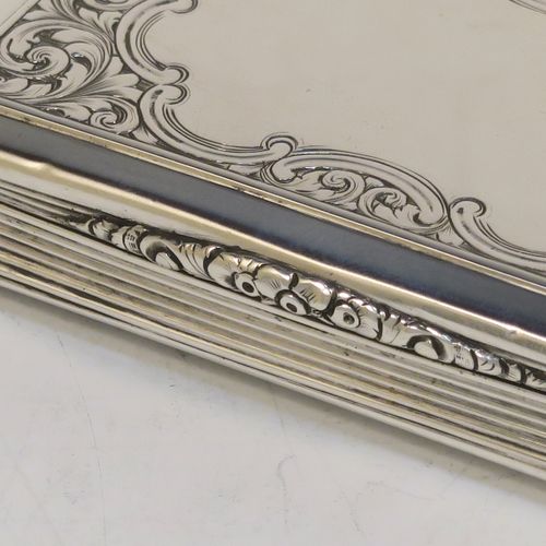 A beautiful Antique Victorian Sterling Silver snuff box, having a rectangular body with hand-engraved floral and scroll work, an applied cast foliate thumb-piece, and a gold-gilt interior. This elegant antique silver snuff box was made by Nathaniel Mills of Birmingham in 1850. The dimensions of this fine hand-made antique silver snuff box are length 7.5 cms (3 inches), width 4.5 cms (1.75 inches), depth 2 cms (0.6 inches), and it weighs approx. 69g (2.2 troy ounces).