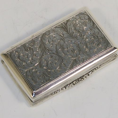 A beautiful Antique Victorian Sterling Silver snuff box, having a rectangular body with hand-engraved floral and scroll work, an applied cast foliate thumb-piece, and a gold-gilt interior. This elegant antique silver snuff box was made by Nathaniel Mills of Birmingham in 1850. The dimensions of this fine hand-made antique silver snuff box are length 7.5 cms (3 inches), width 4.5 cms (1.75 inches), depth 2 cms (0.6 inches), and it weighs approx. 69g (2.2 troy ounces).
