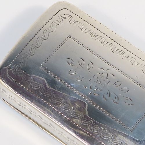 An elegant Antique Georgian Sterling Silver snuff box, having a rectangular body, with a slightly curved profile for holding in a waist-coat pocket, with hand-engraved geometrical & floral decoration, with a vacant rectangular cartouche on one side, a hinged lid and a gold-gilt interior. This beautiful antique silver snuff box was made by Joseph Willmore of Birmingham in 1826. The dimensions of this fine hand-made silver box are length 5.5 cms (2.25 inches), width 3.5 cms (1.3 inches), and it weighs approx. 27g (0.9 troy ounces).