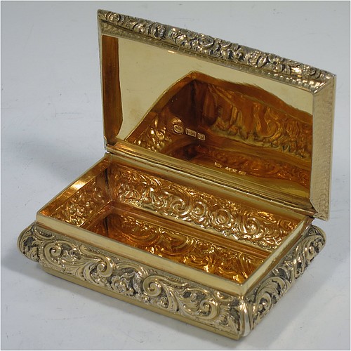 A rare and beautiful Antique Victorian Sterling Silver and gold-gilt large and heavy snuff box, having a rectangular body with applied cast foliate borders, a hinged lid with an applied panel with foliate border and vacant cartouche, the base with an applied panel having hand-engraved foliate & geometrical decoration, the sides with hand-chased floral work. Made by Fredrick Marson of Birmingham in 1848. The dimensions of this fine hand-made antique silver snuff box are length 9 cms (3.5 inches), width 6 cms (2.3 inches), depth 3 cms (1.25 inches), and it weighs approx. 167g (5.3 troy ounces).