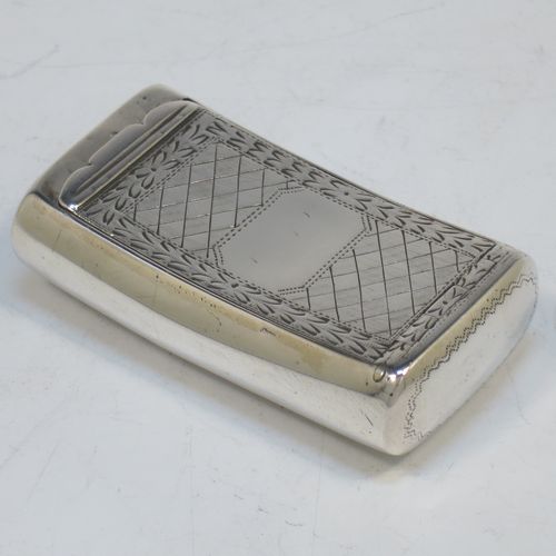 A rare and handsome Irish Antique Georgian Sterling Silver snuff box, having a rectangular body, with a slightly curved profile for holding in a waist-coat pocket, with hand-engraved geometrical & floral decoration, a vacant round cartouche on one side, and a flat invisibly hinged lid with thumb-piece. Made in Dublin, Ireland, in 1820. The dimensions of this fine hand-made antique Irish silver snuff box are length 5.5 cms (2.25 inches), width 3 cms (01.25 inches), and it weighs approx. 25g (0.8 troy ounces).