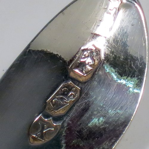 An Antique Georgian Sterling Silver large Irish soup ladle in the Irish Bright-Cut pattern, having a hand-engraved handle with bright-cut decoration, and a hand-chased shell style round bowl. Made in Dublin in 1794. The dimensions of this fine hand-made antique silver soup ladle are length 34 cms (13.3 inches), and it weighs approx. 159g (5.1 troy ounces). Please note that this item is crested.