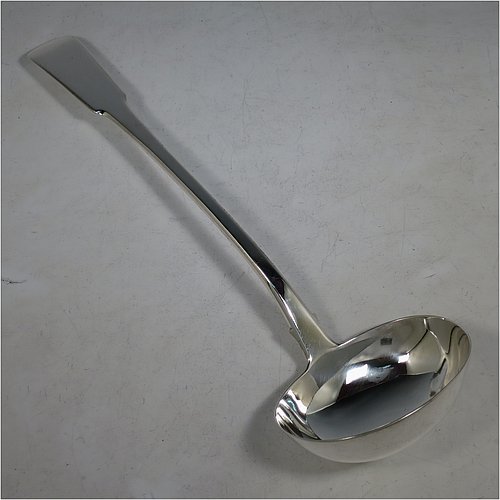 An Antique Georgian Sterling Silver soup ladle in the Fiddle pattern, having a plain handle with a pip on the reverse, and a plain round bowl with shoulders above and a heel on the reverse. Made by Sarah & John William Blake of London in 1820. The dimensions of this fine hand-made antique silver soup ladle are length 34 cms (13.5 inches), and it weighs approx. 280g (9 troy ounces).