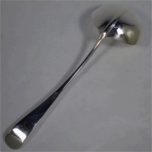 A very handsome Antique Edwardian Sterling Silver soup ladle in the Hanoverian Rattail pattern, having a plain handle with ridge and pip, and plain bowl with rattail on reverse. Made by Charles William Fletcher of Sheffield in 1905. The dimensions of this fine hand-made antique silver soup ladle are length 30 cms (11.75 inches), and it weighs approx. 251g (8 troy ounces).