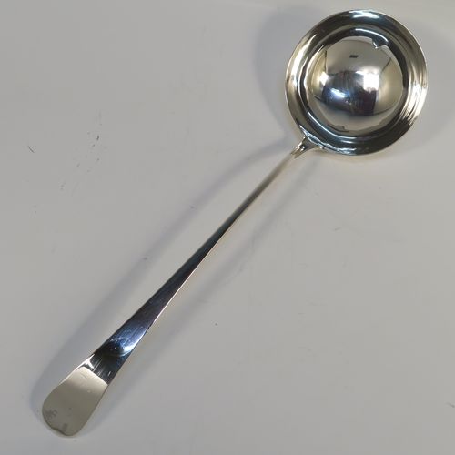 A handsome Antique Georgian Sterling Silver soup ladle in the Old English pattern, having a plain handle with a pip on the reverse, and a plain round bowl with a heel on the reverse. This elegant silver soup ladle was made by John Lambe of London in 1781. The dimensions of this fine hand-made antique silver soup ladle are length 33 cms (13 inches), and it weighs approx. 157g (5 troy ounces).