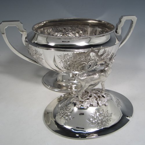 Antique Victorian silver plated soup tureen, having a pull-off lid with a cast model of a stag, with hand-chased floral decoration, applied bead-edged borders, two scroll side-handles, and all sitting on a pedestal foot. Made in ca. 1870. The dimensions of this fine hand-made silver-plated soup tureen and cover are height 33 cms (13 inches), length including handles 37 cms (14.5 inches), and width 20 cms (8 inches).