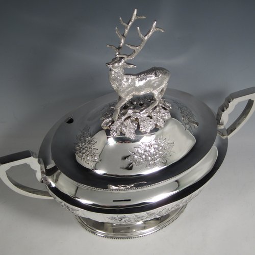 Antique Victorian silver plated soup tureen, having a pull-off lid with a cast model of a stag, with hand-chased floral decoration, applied bead-edged borders, two scroll side-handles, and all sitting on a pedestal foot. Made in ca. 1870. The dimensions of this fine hand-made silver-plated soup tureen and cover are height 33 cms (13 inches), length including handles 37 cms (14.5 inches), and width 20 cms (8 inches).