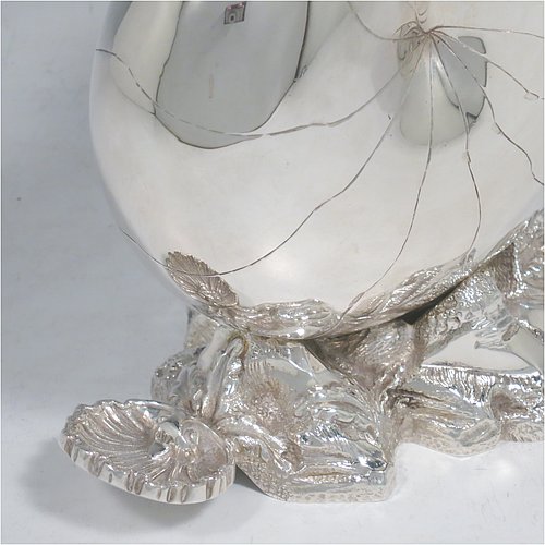 An Antique Victorian Silver Plated spoon warmer, in the shape of a Nautilus shell, having a hand-chased body with invisibly hinged lid opening, and all sitting on a cast rock base with shell thumb-piece. Made by the Atkin Brothers of Sheffield in ca. 1880. The dimensions of this fine hand-made silver-plated spoon warmer are length 16.5 cms (6.5 inches), height 14 cms (5.5 inches), and width 9 cms (3.5 inches).