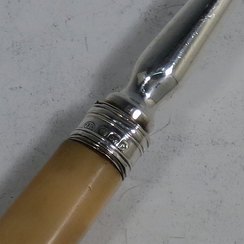 An Antique Georgian Sterling Silver and bone handled stilton cheese scoop, having a hand-cut handle, a hand-chased reeded ferrule, and a plain rounded cross-section stem with robust scoop. Made by Joseph Willmore of Birmingham in 1805. The dimensions of this fine hand-made antique silver and bone stilton cheese scoop are length 23.5 cms (9.25 inches).