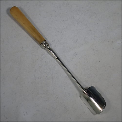 An Antique Georgian Sterling Silver and bone handled stilton cheese scoop, having a hand-cut handle, a hand-chased reeded ferrule, and a plain rounded cross-section stem with robust scoop. Made by Joseph Willmore of Birmingham in 1805. The dimensions of this fine hand-made antique silver and bone stilton cheese scoop are length 23.5 cms (9.25 inches).