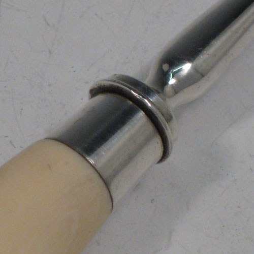 Antique Victorian sterling silver stilton cheese scoop, having a very plain body with hand-cut ivory handle, plain round ferrule, and plain shank with scoop. Made by Angel and Savoury of London in 1881. The dimensions of this fine hand-made silver stilton cheese scoop are length 23 cms (9 inches).