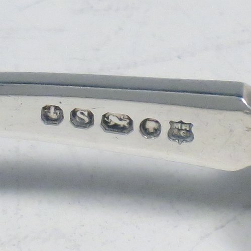 An Antique Victorian Sterling Silver and bone handled stilton cheese scoop, having a hand-cut fluted handle, a hand-chased reeded ferrule, and a plain square cross-section stem with robust scoop. Made by Martin Hall & Co., of Sheffield in 1860. The dimensions of this fine hand-made antique silver and bone-handled stilton cheese scoop are length 21.5 cms (8.5 inches).