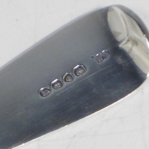 Antique late Georgian sterling silver pair of stuffing or basting spoons, in the Fiddle pattern, having plain oval pointed bowls, and plain long handles with pips on the reverse. Made by William Eley of London in 1830. The length of these fine hand-made silver basting / stuffing spoons is 30.5 cms (12 inches), and the total weight is approx. 224g (7.2 troy ounces).