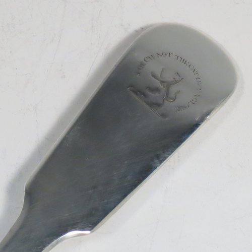 An Antique Georgian sterling silver Scottish Fiddle pattern stuffing spoon, having a very plain handle with pip on reverse, and a plain oval bowl. Made in Edinburgh in 1812. The dimensions of this fine hand-made antique silver stuffing spoon are length 31 cms (12.25 inches), and it weighs approx. 122g (4 troy ounces). Please note that this item is crested with Touch Not the Cat but a Glove for either the Mackpherson or Mackintosh clan.