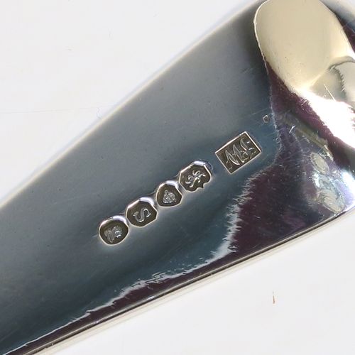 An elegant Antique Georgian Sterling Silver Old English pattern stuffing spoon, having a very plain handle with pip on reverse, and a plain oval bowl. This handsome antique silver serving spoon was made by John Whiting of London in 1833. The dimensions of this fine hand-made antique silver stuffing spoon are length 30.5 cms (12 inches), and it weighs approx. 128g (4.1 troy ounces).

  