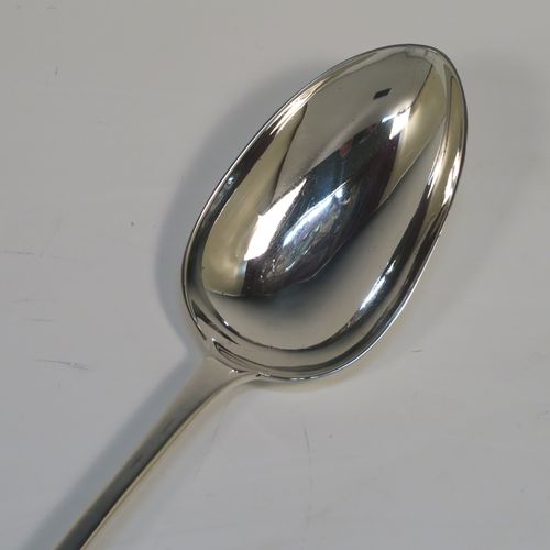 An elegant Antique Georgian Sterling Silver Old English pattern stuffing spoon, having a very plain handle with pip on reverse, and a plain oval bowl. This handsome antique silver serving spoon was made by John Whiting of London in 1833. The dimensions of this fine hand-made antique silver stuffing spoon are length 30.5 cms (12 inches), and it weighs approx. 128g (4.1 troy ounces).

  