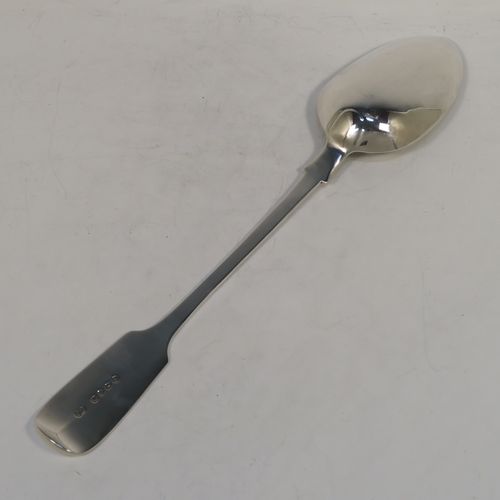 A handsome Antique Victorian Sterling Silver Fiddle pattern stuffing spoon, having a very plain handle with pip on reverse, and a plain oval bowl with shoulders above. This elegant antique silver serving spoon was made by Charles Boyton I of London in 1884. The dimensions of this fine hand-made antique silver stuffing spoon are length 31 cms (12.25 inches), and it weighs approx. 142g (4.6 troy ounces).  