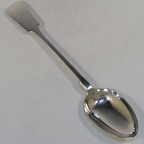 A handsome Antique Victorian Sterling Silver Fiddle pattern stuffing spoon, having a very plain handle with pip on reverse, and a plain oval bowl with shoulders above. This elegant antique silver serving spoon was made by Charles Boyton I of London in 1884. The dimensions of this fine hand-made antique silver stuffing spoon are length 31 cms (12.25 inches), and it weighs approx. 142g (4.6 troy ounces).  