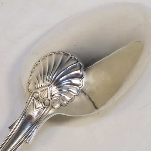 A handsome Antique Sterling Silver stuffing spoon in the double-struck Fiddle, Thread, and Shell patKings pattern. This beautiful antique silver stuffing or basting spoon was made by Francis Higgins of London in 1912. The dimensions of this fine hand-made silver stuffing spoon are length 30.5 cms (12 inches), and it weighs approx. 209g (6.7 troy ounces).