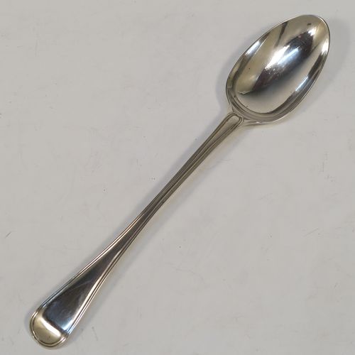 A very handsome Antique Victorian Sterling Silver stuffing spoon in the double-struck Old English and Thread pattern. This elegant antique silver spoon was made by George Adams of London in 1848. The dimensions of this fine hand-made antique silver stuffing spoon are length 30.5 cms (12 inches), and it weighs approx. 150g (4.8 troy ounces).   